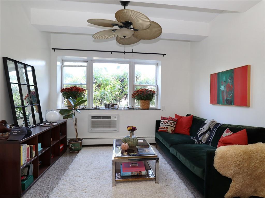 643 Morgan Avenue Brooklyn, NY 11222 - Photo 32 of 50 a living room with furniture and a flat screen tv