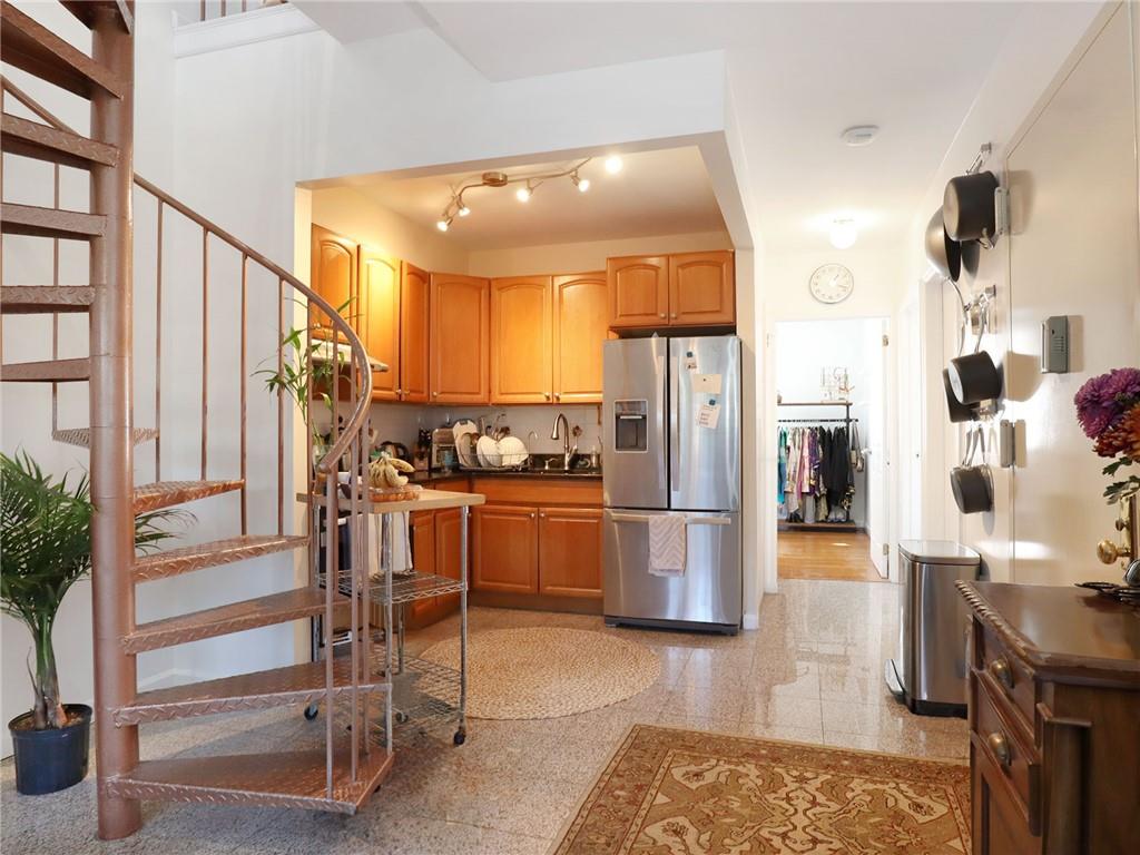 643 Morgan Avenue Brooklyn, NY 11222 - Photo 33 of 50 a kitchen with a refrigerator and countertop