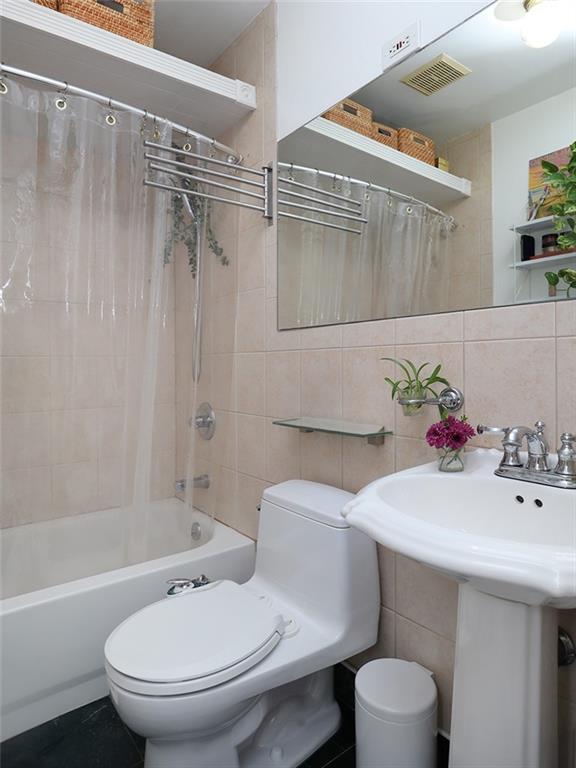 643 Morgan Avenue Brooklyn, NY 11222 - Photo 42 of 50 a bathroom with a sink toilet and shower