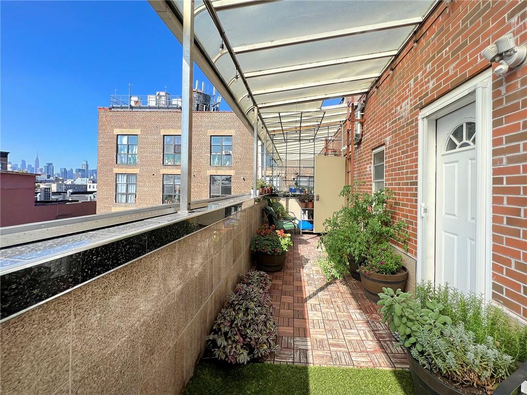 643 Morgan Avenue Brooklyn, NY 11222 - Photo 43 of 50 a view of a house with a yard