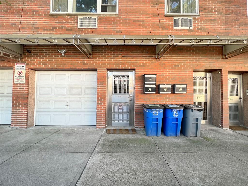 643 Morgan Avenue Brooklyn, NY 11222 - Photo 49 of 50 a front view of a house with a garage