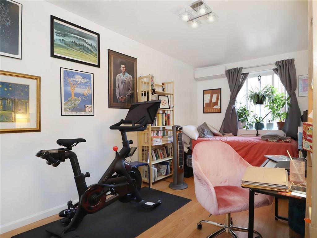 643 Morgan Avenue Brooklyn, NY 11222 - Photo 9 of 50 a view of a workspace with furniture and a window