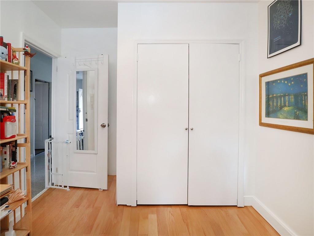 643 Morgan Avenue Brooklyn, NY 11222 - Photo 10 of 50 a view of a hallway with wooden floor and cabinet