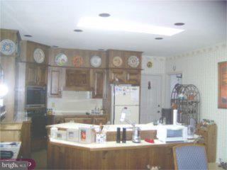311 South Bank Road Landenberg, PA 19350 - Photo 2 of 4 a view of kitchen with cabinets and wooden floor
