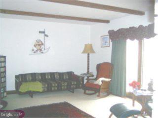 311 South Bank Road Landenberg, PA 19350 - Photo 4 of 4 a living room with furniture and a lamp