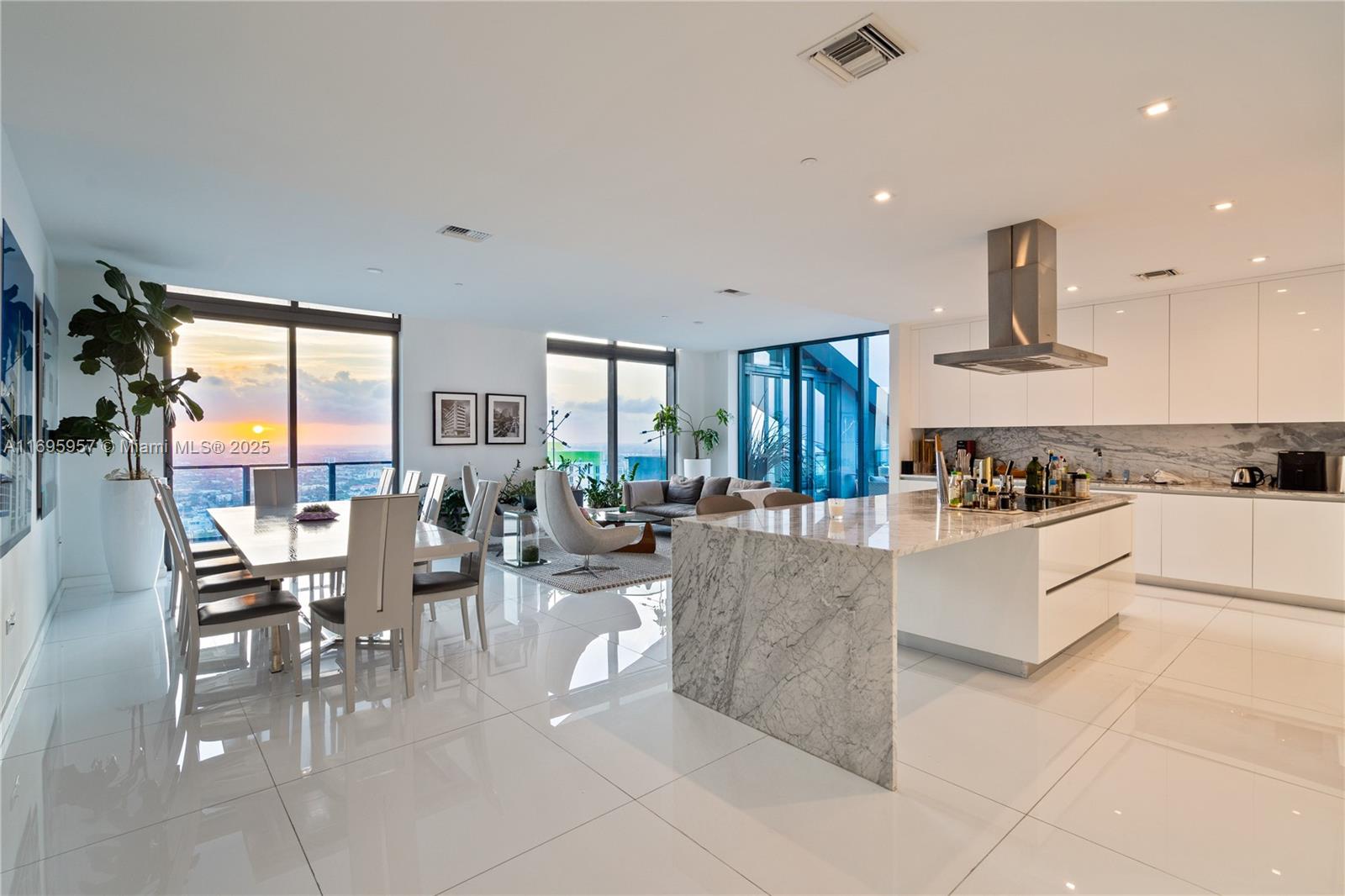 88 Southwest 7th Street, Unit 4203 Miami, FL 33130 - Photo 28 of 96 a large white kitchen with lots of counter top space and stainless steel appliances