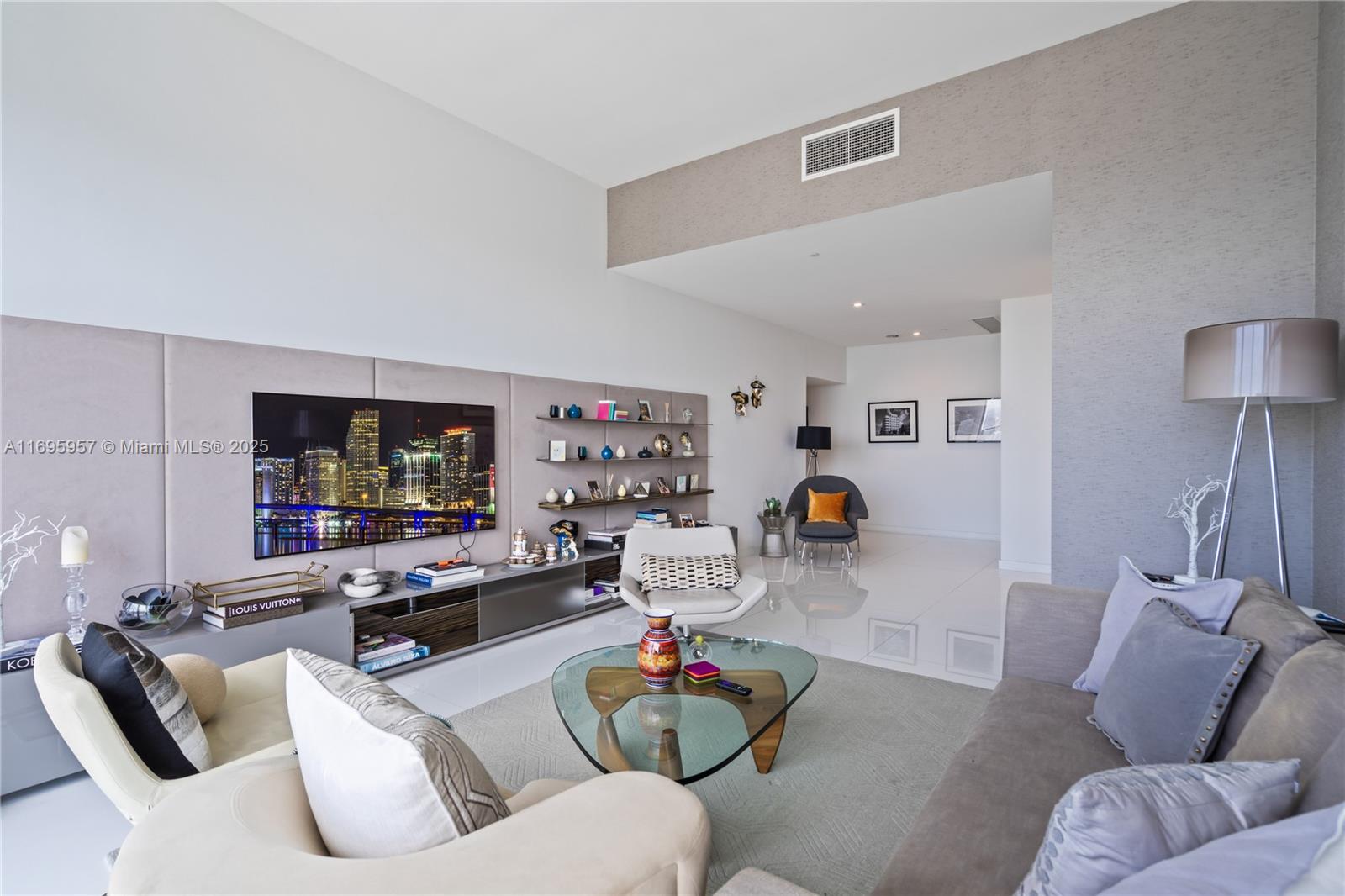88 Southwest 7th Street, Unit 4203 Miami, FL 33130 - Photo 42 of 96 a living room with furniture and a flat screen tv