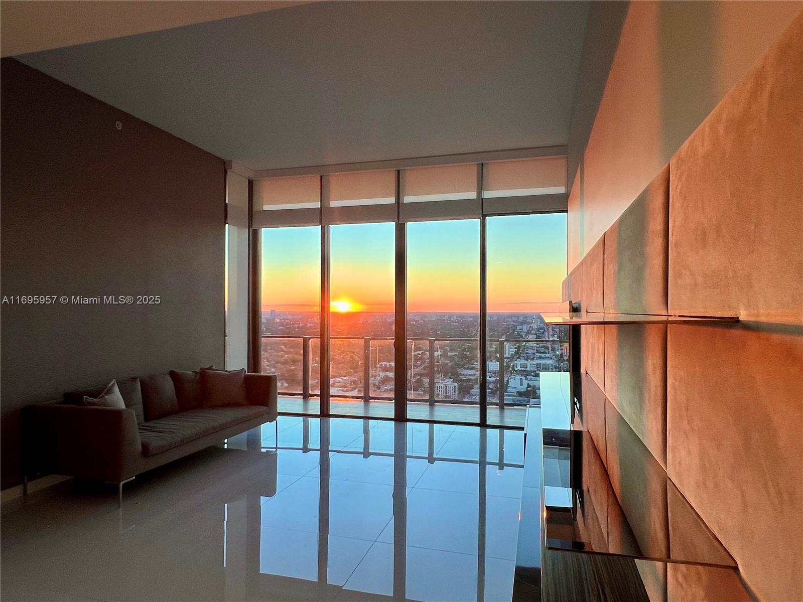 88 Southwest 7th Street, Unit 4203 Miami, FL 33130 - Photo 45 of 96 a living room with furniture and a floor to ceiling window