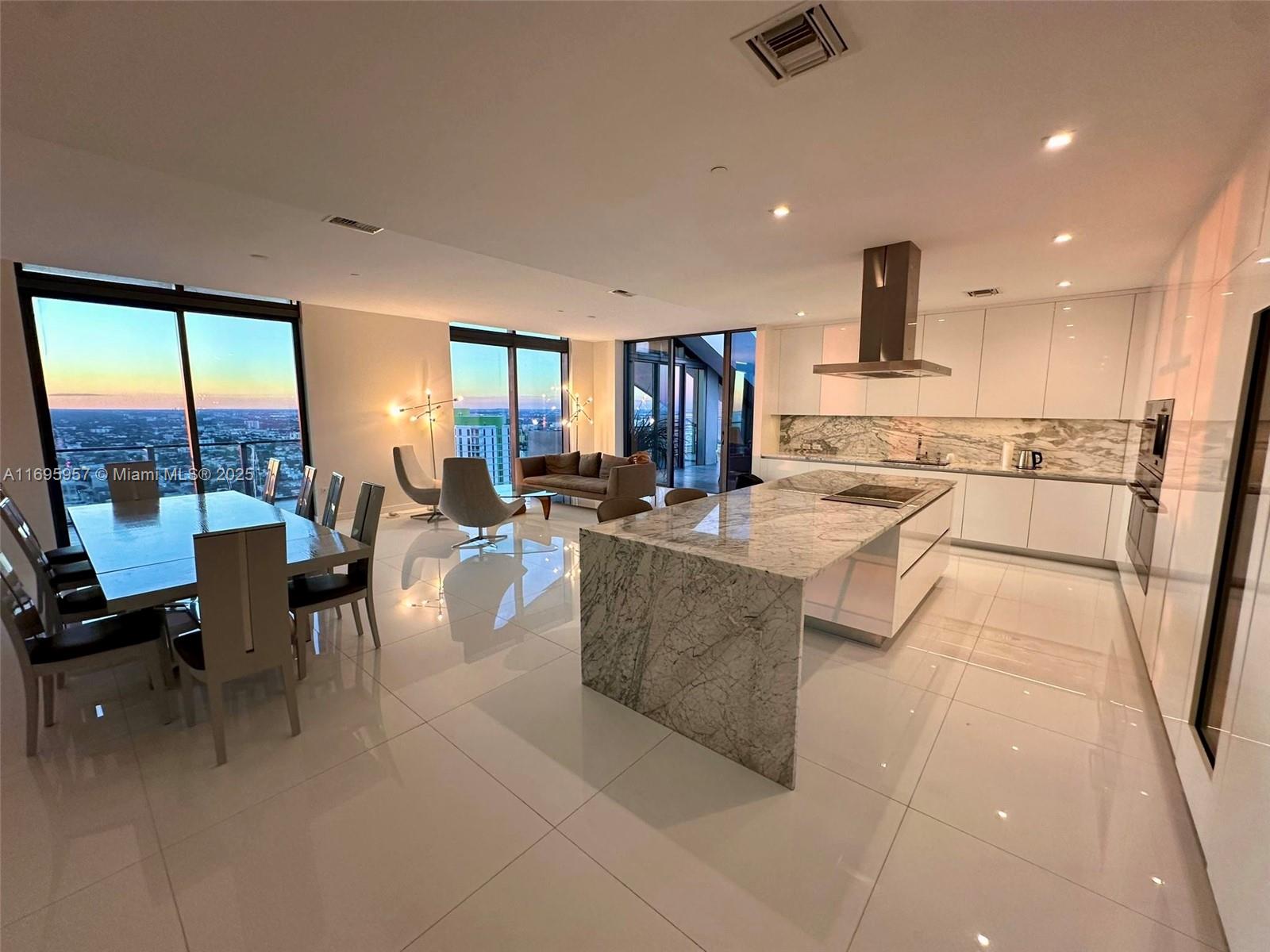 88 Southwest 7th Street, Unit 4203 Miami, FL 33130 - Photo 63 of 96 a living room with stainless steel appliances furniture a rug and a view of kitchen
