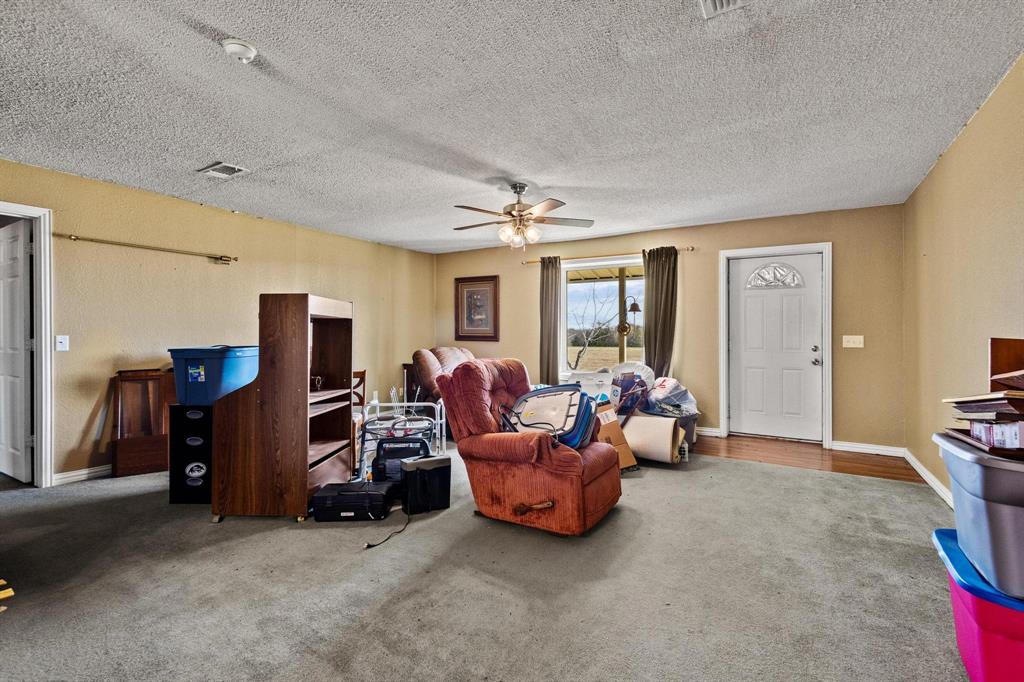 1841 County Road Honey Grove, TX 75446 - Photo 12 of 32 a living room with furniture and a flat screen tv