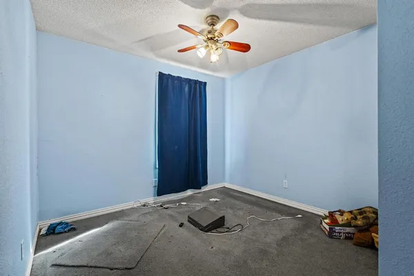 a room with a bed and a chandelier