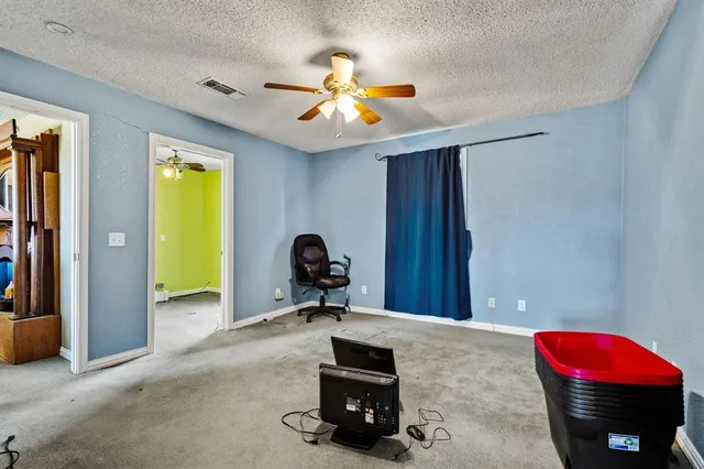 a bed room with furniture and a chandelier