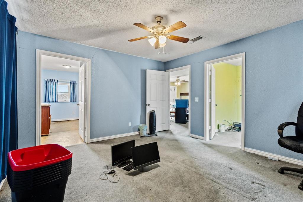 1841 County Road Honey Grove, TX 75446 - Photo 10 of 32 a living room with furniture and a large window