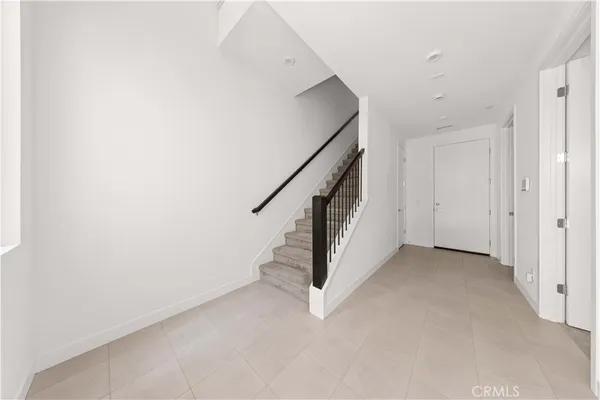 an empty room with staircase