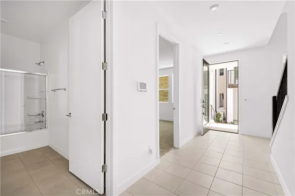 a bathroom with a granite countertop sink a toilet and shower