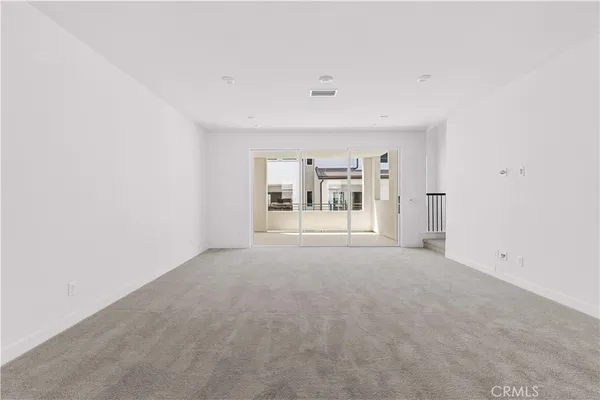 a spacious bathroom with a granite countertop sink and a shower