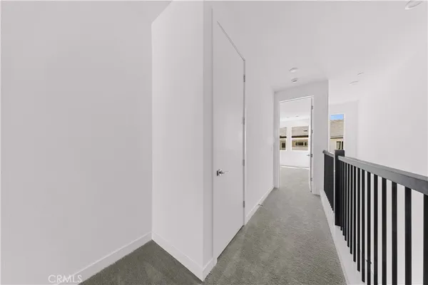 a view of a hallway with a wooden floor