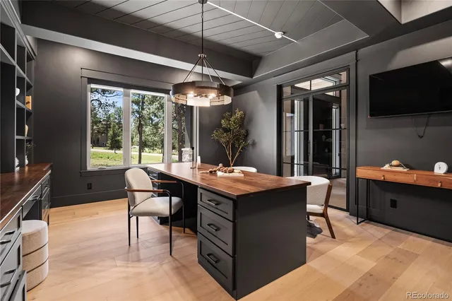 a view of a dining room with furniture window and outside view