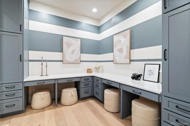 a kitchen with a sink appliances and cabinets