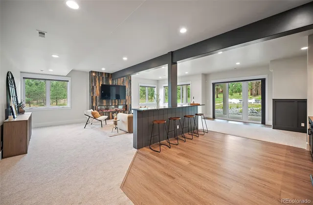 a room with furniture and a large window