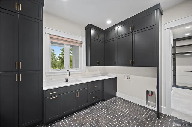 a bathroom with a double vanity sink toilet and mirror