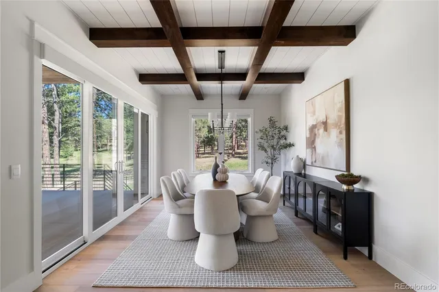 a dining room with furniture and windows