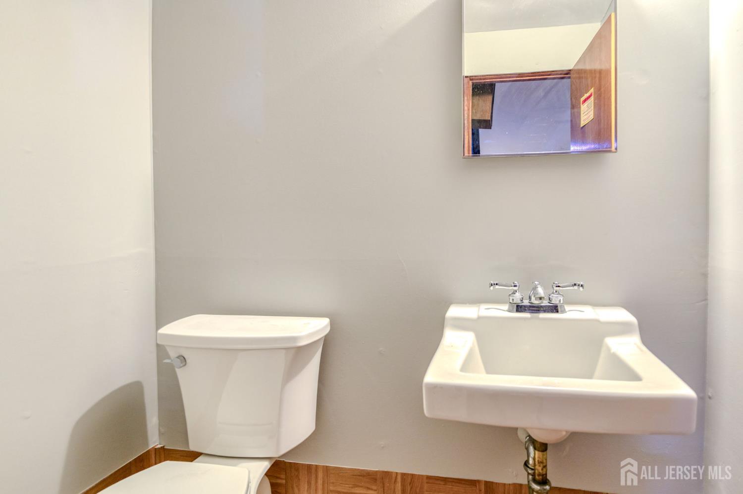 347 Lincoln Boulevard Middlesex, NJ 08846 - Photo 14 of 25 a white toilet sitting next to a white sink