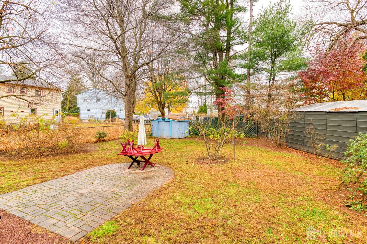 347 Lincoln Boulevard Middlesex, NJ 08846 - Photo 24 of 25 a blue bench sitting in the middle of a yard