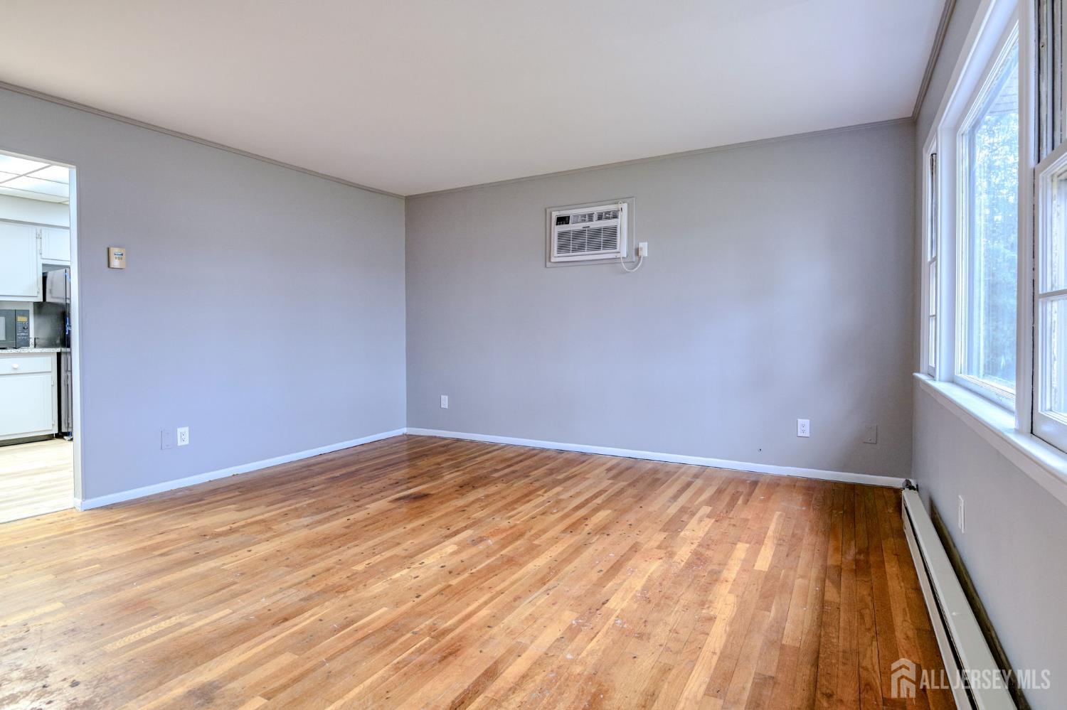 347 Lincoln Boulevard Middlesex, NJ 08846 - Photo 3 of 25 a view of an empty room and window