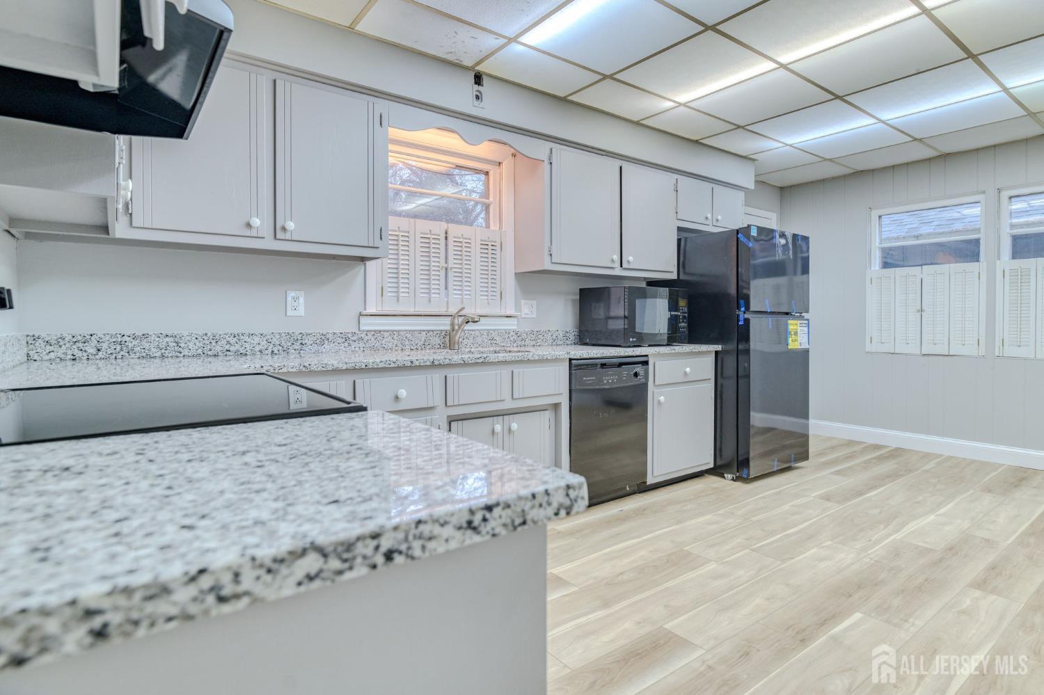 347 Lincoln Boulevard Middlesex, NJ 08846 - Photo 8 of 25 a kitchen with stainless steel appliances granite countertop a sink stove and refrigerator