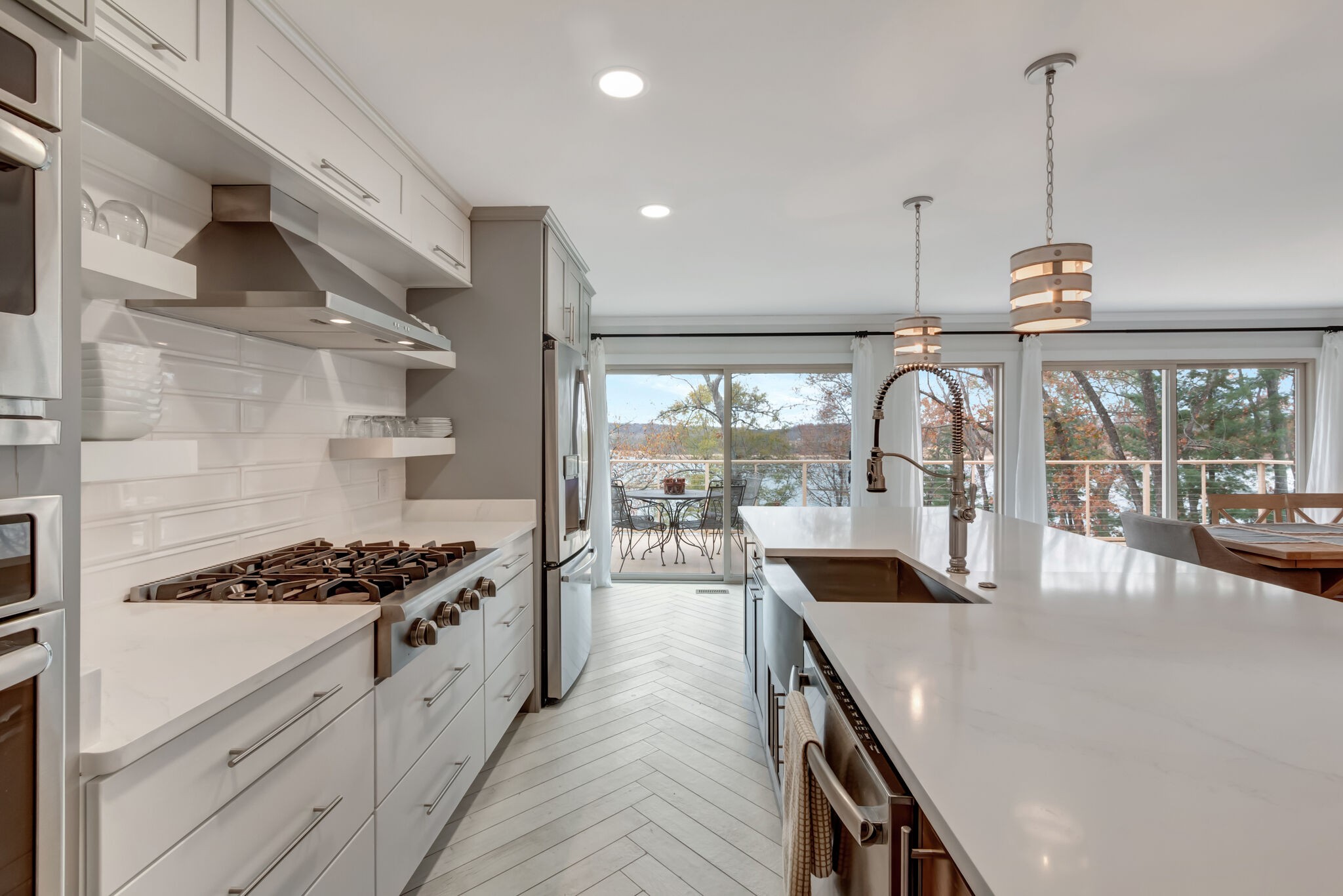 326 Loop Drive Winchester, TN 37398 - Photo 11 of 50 a kitchen with stainless steel appliances granite countertop a stove a sink and a wooden floor