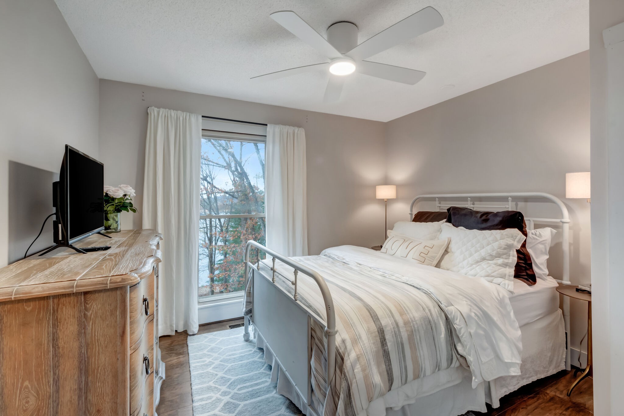 326 Loop Drive Winchester, TN 37398 - Photo 23 of 50 a bedroom with a bed and a flat tv screen on dresser