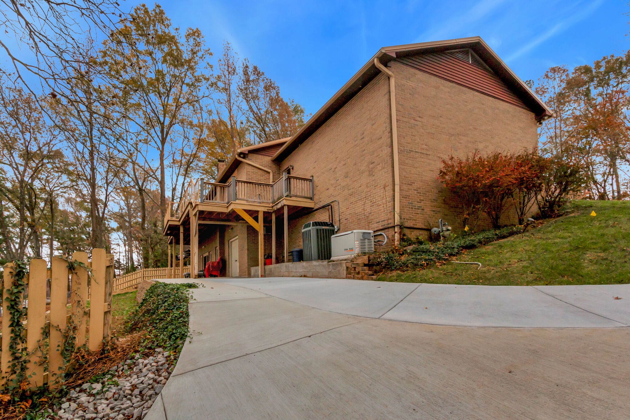 326 Loop Drive Winchester, TN 37398 - Photo 49 of 50 a view of a white house with a small yard and large tree