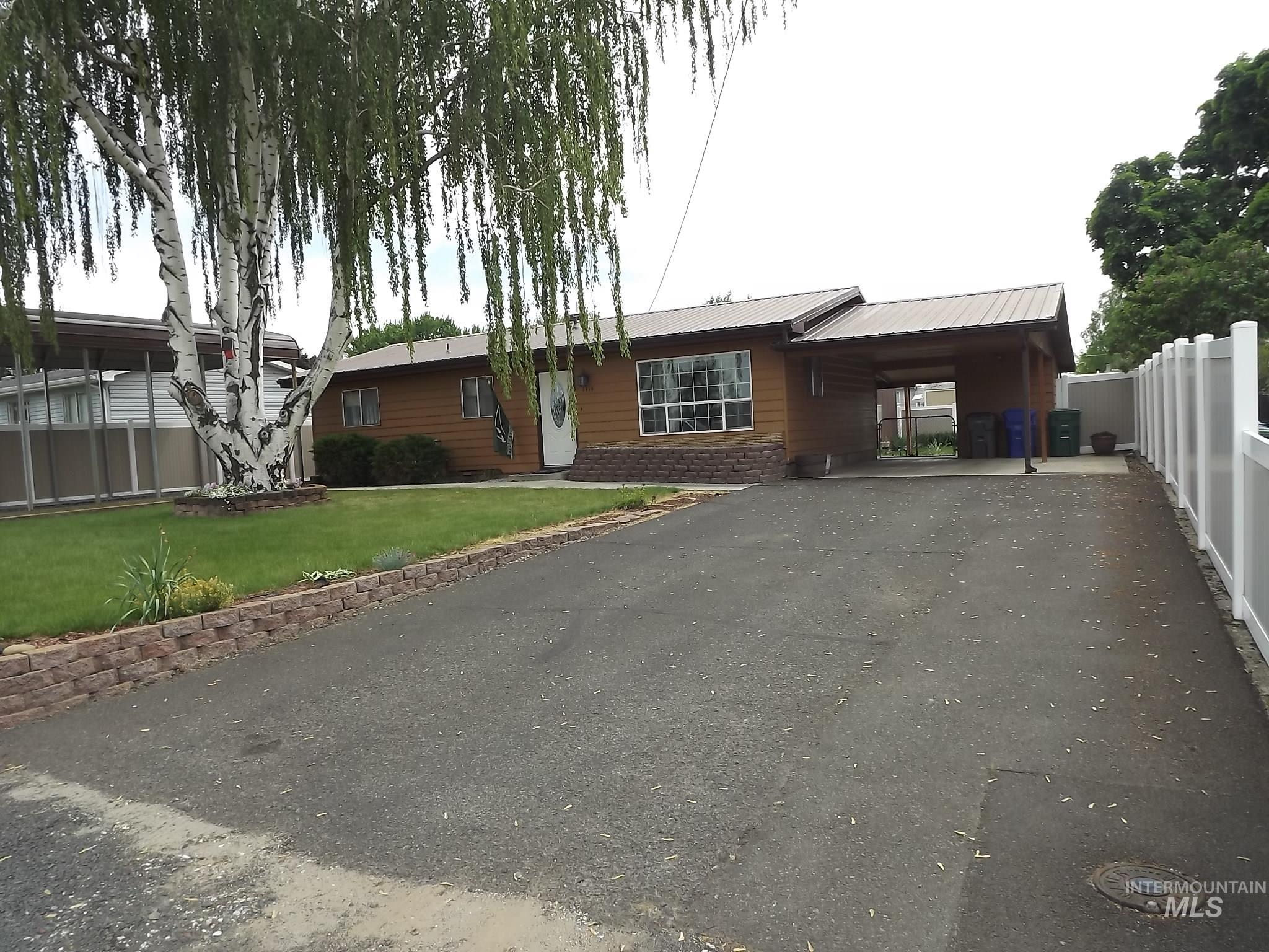 1114 Alder Avenue Lewiston, ID 83501 - Photo 1 of 1 Single-story residence featuring wood siding and a metal roof