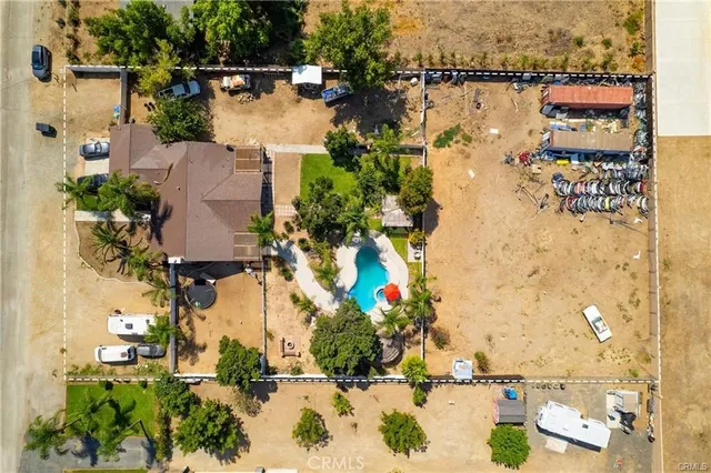 an aerial view of a house with a lake view
