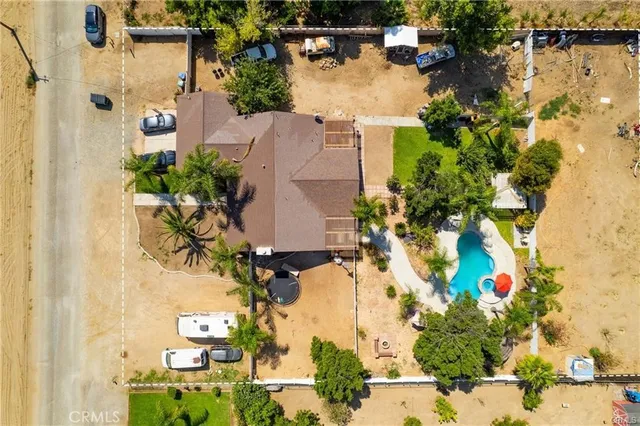 an aerial view of a houses with yard