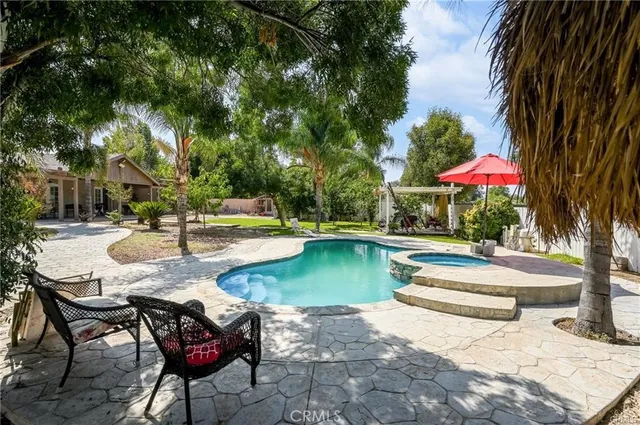 a view of a patio with swimming pool