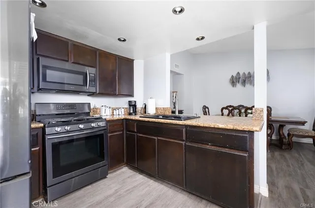 a kitchen with a stove and a microwave