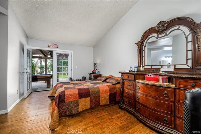 a bed room with a bed and a mirror