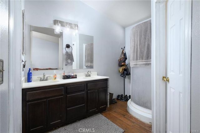 a bathroom with a double vanity sink and mirror