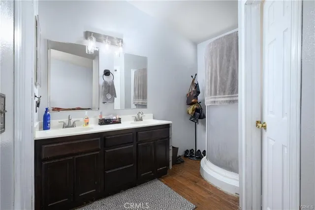 a bathroom with a double vanity sink and mirror
