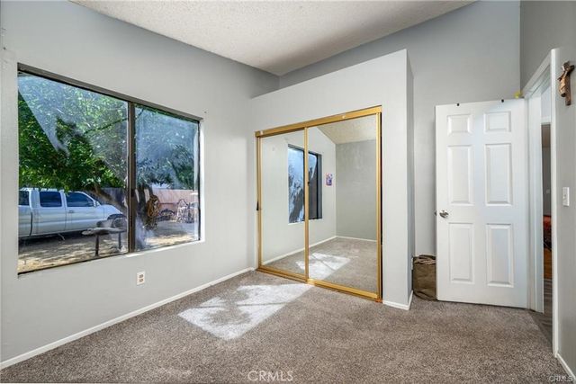 a bedroom with a bed and dresser