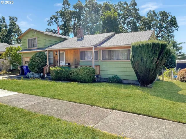 a view of a house with a garden