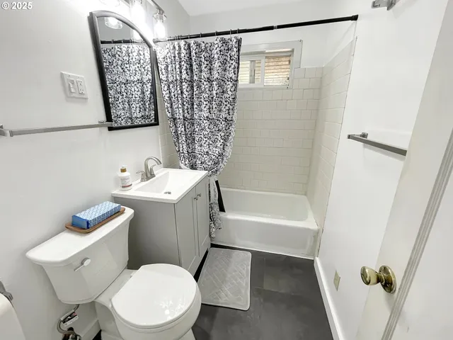 a white toilet sitting next to a bathroom sink