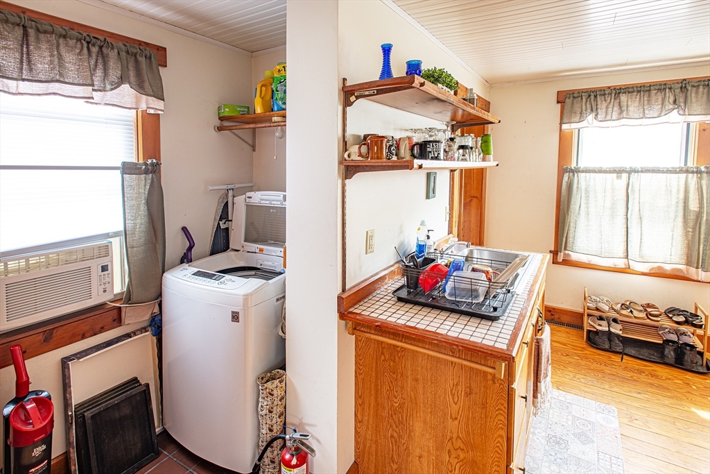 104-106 Everett Street Easthampton, MA 01027 - Photo 9 of 28 a kitchen with a refrigerator and a stove