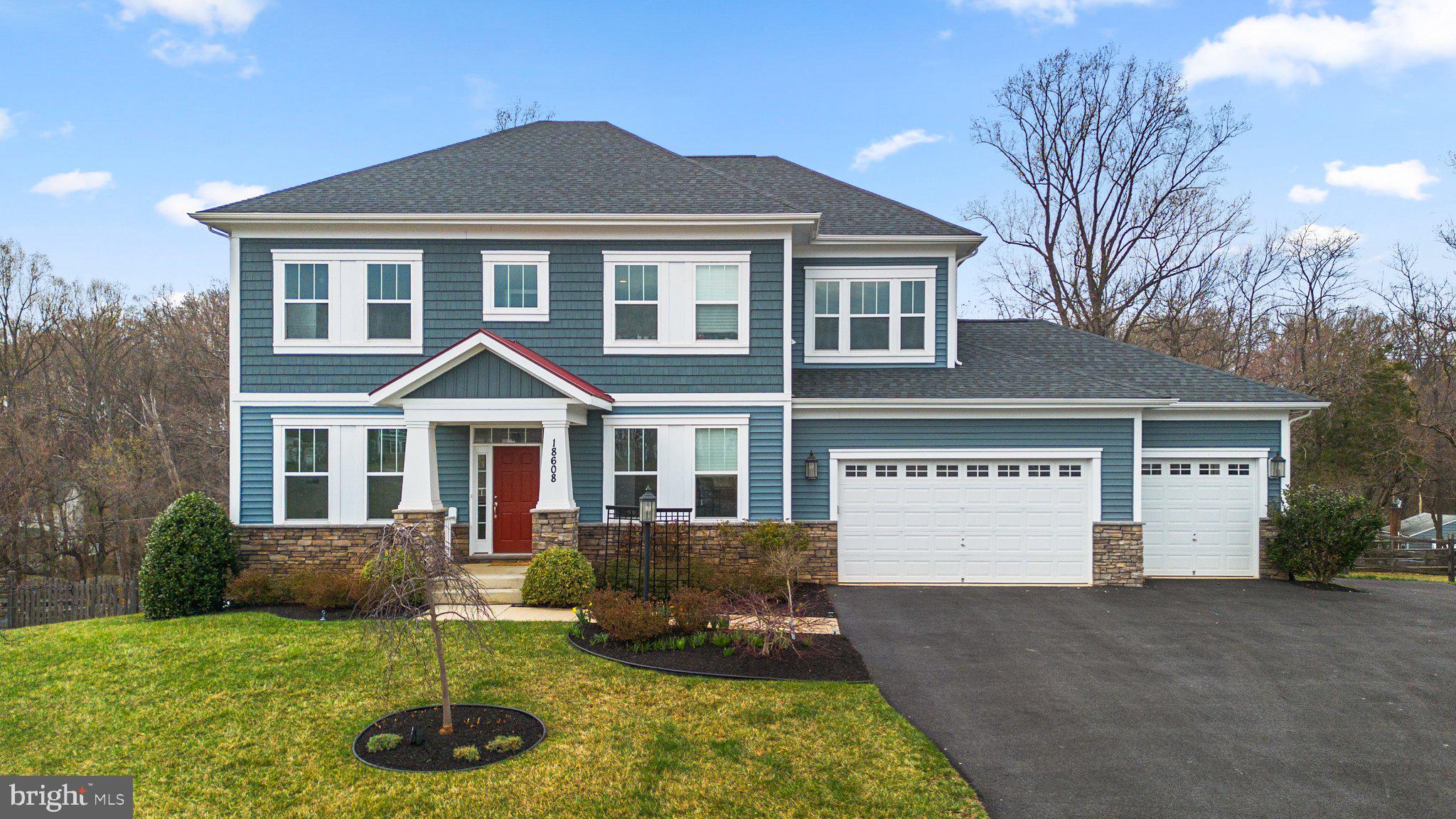 18608 Compher Court Poolesville, MD 20837 - Photo 1 of 40 a front view of a house with yard and trees