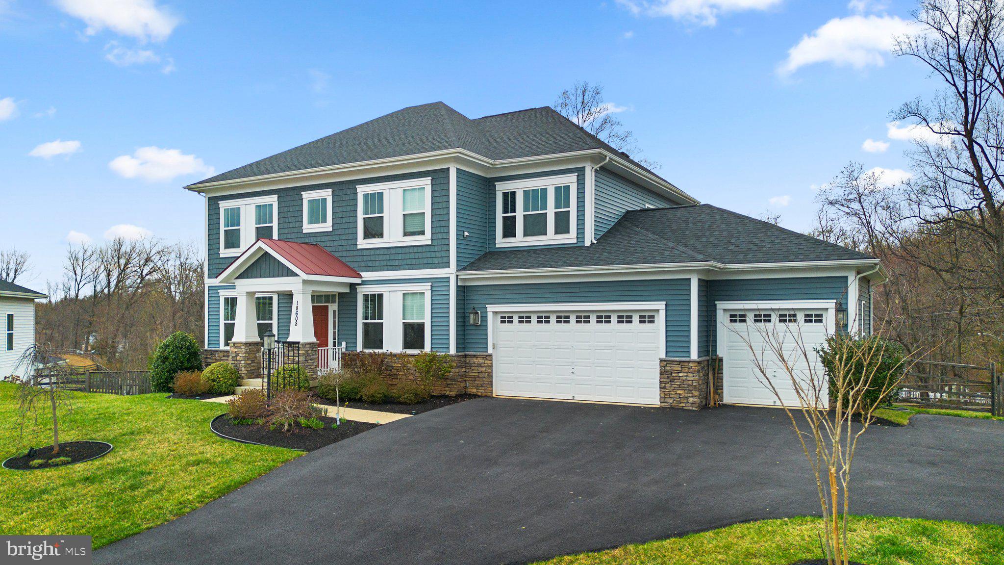 18608 Compher Court Poolesville, MD 20837 - Photo 2 of 40 a front view of a house with garden