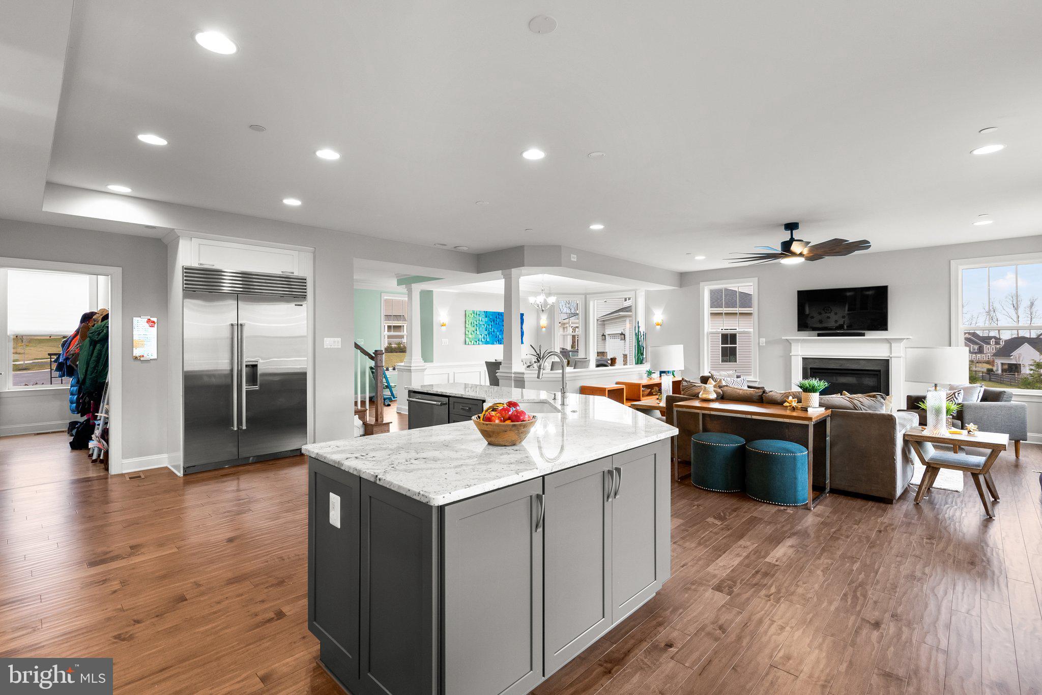 18608 Compher Court Poolesville, MD 20837 - Photo 9 of 40 a open kitchen with stainless steel appliances granite countertop a sink stove and refrigerator