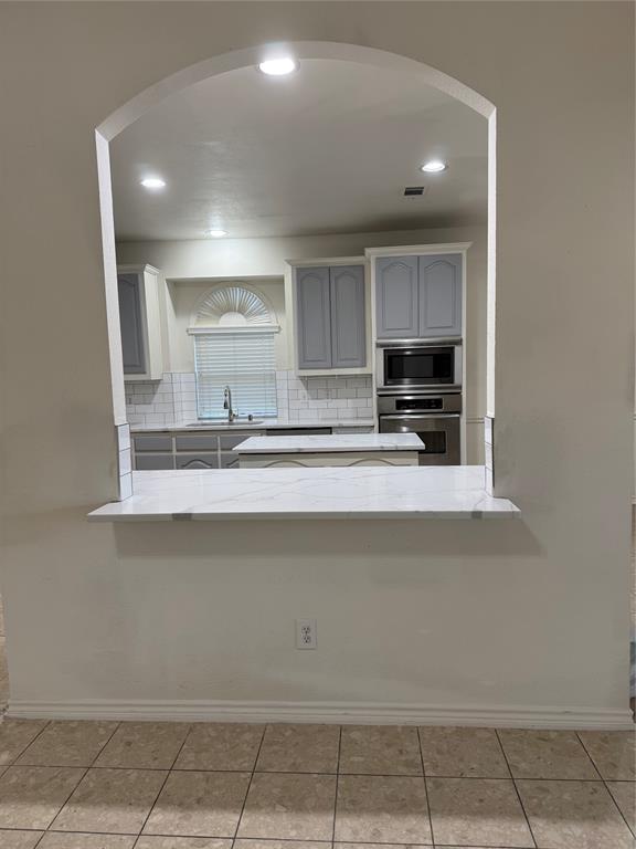 5817 Mulvane Drive Plano, TX 75094 - Photo 16 of 39 a kitchen with a sink and cabinets