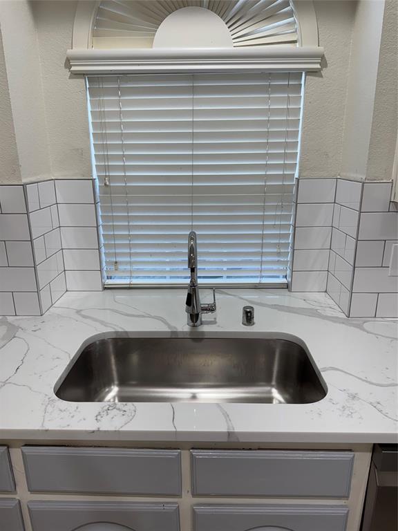 5817 Mulvane Drive Plano, TX 75094 - Photo 20 of 39 a close view of sink and washing machine